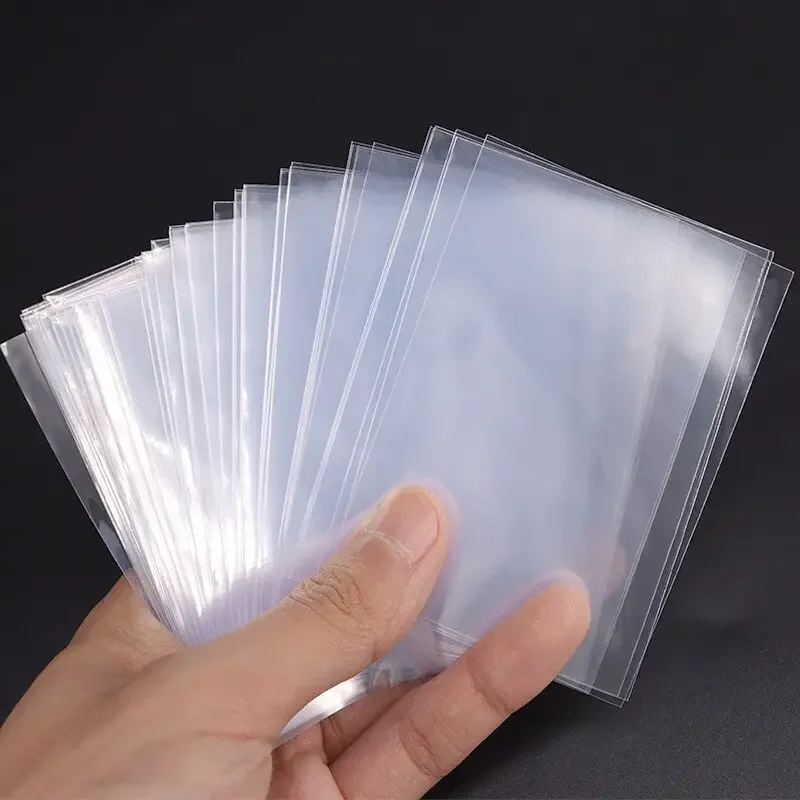 300/100Pcs 66*91mm Card Sleeve - Card Sleeves Protector recension och pris
